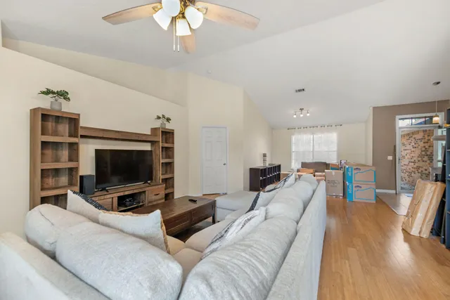 a living room with furniture and a flat screen tv