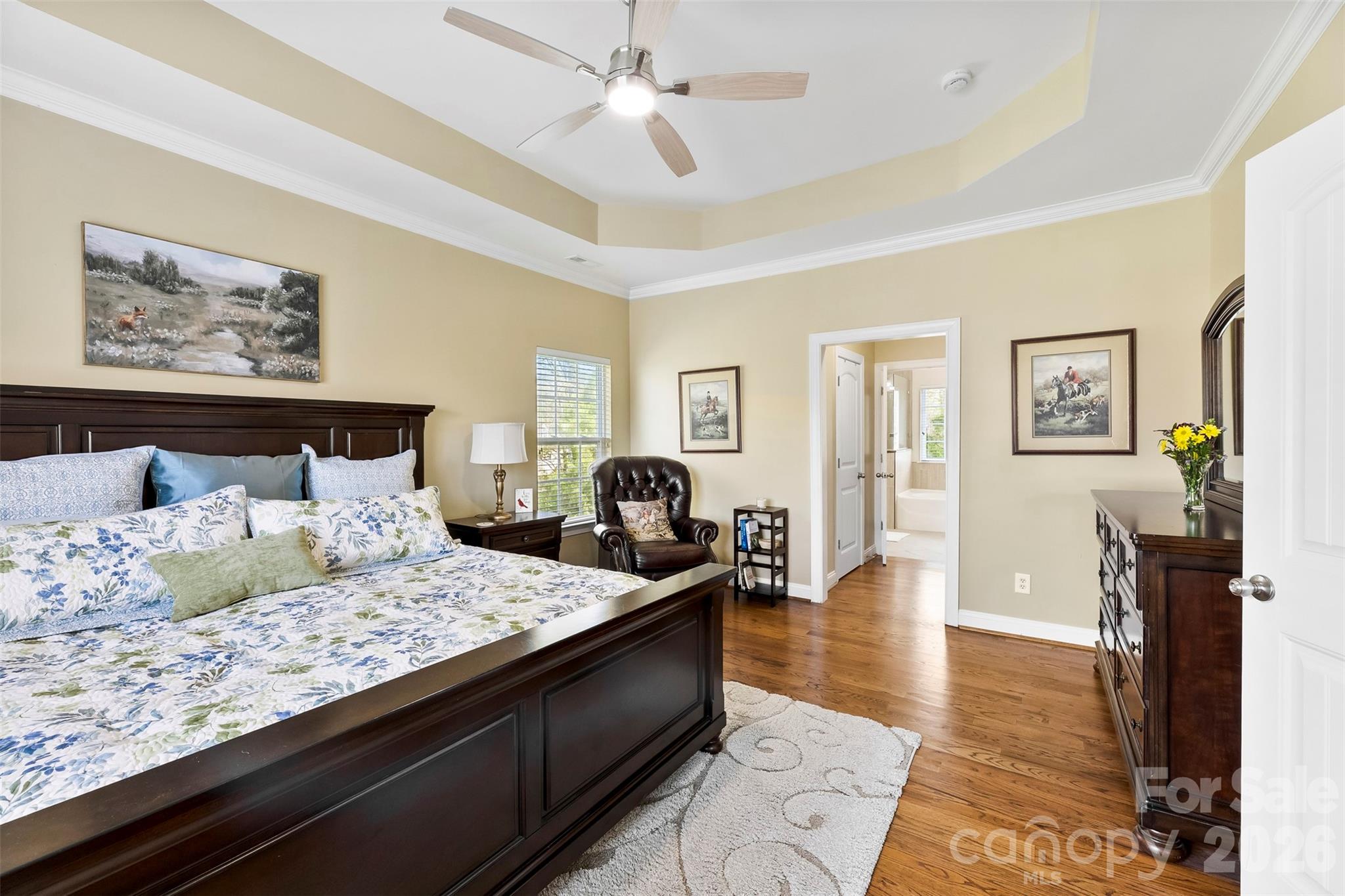 7574 Manakin Place Fort Mill, SC 29707 - Photo 17 of 40 a large bedroom with a bed and wooden floor
