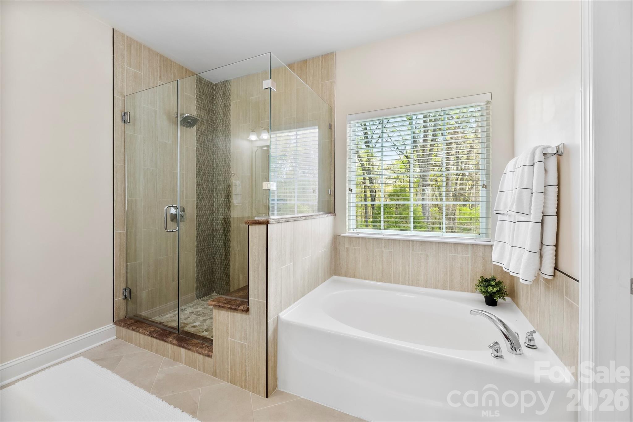 7574 Manakin Place Fort Mill, SC 29707 - Photo 19 of 40 a white bath tub sitting next to a shower