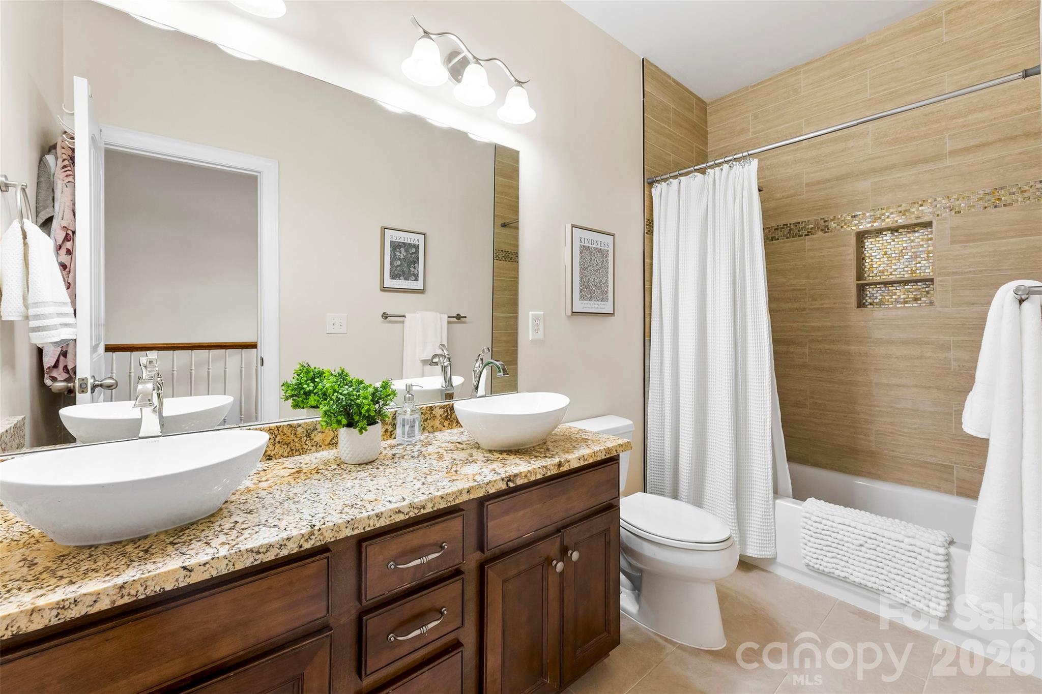 7574 Manakin Place Fort Mill, SC 29707 - Photo 23 of 40 a bathroom with a granite countertop sink and a mirror