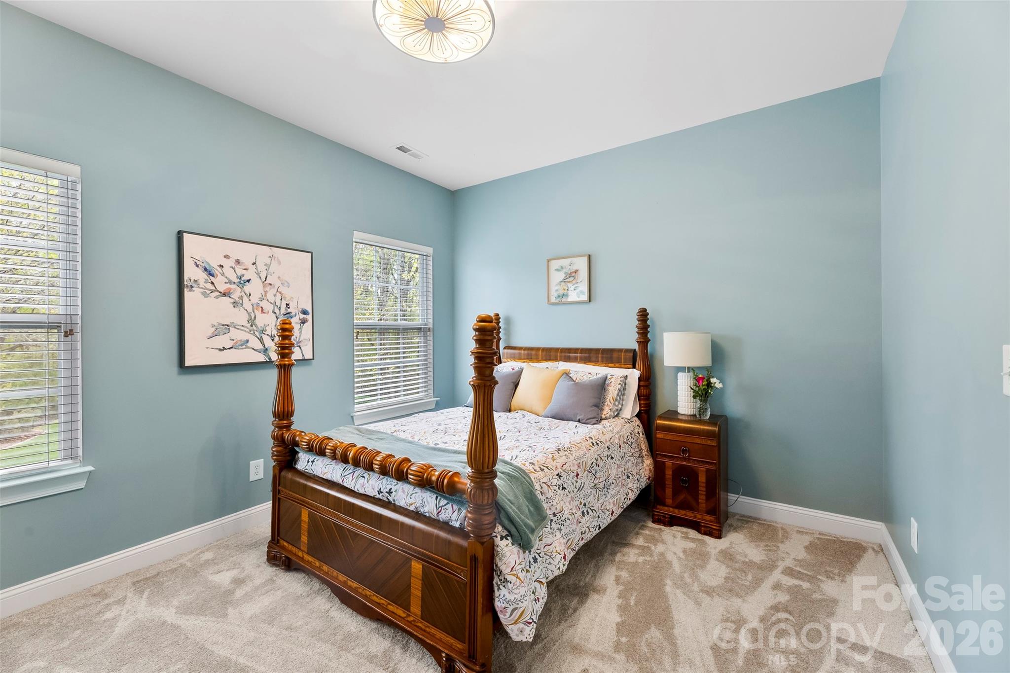 7574 Manakin Place Fort Mill, SC 29707 - Photo 24 of 40 a bed room with a bed and painting on the wall