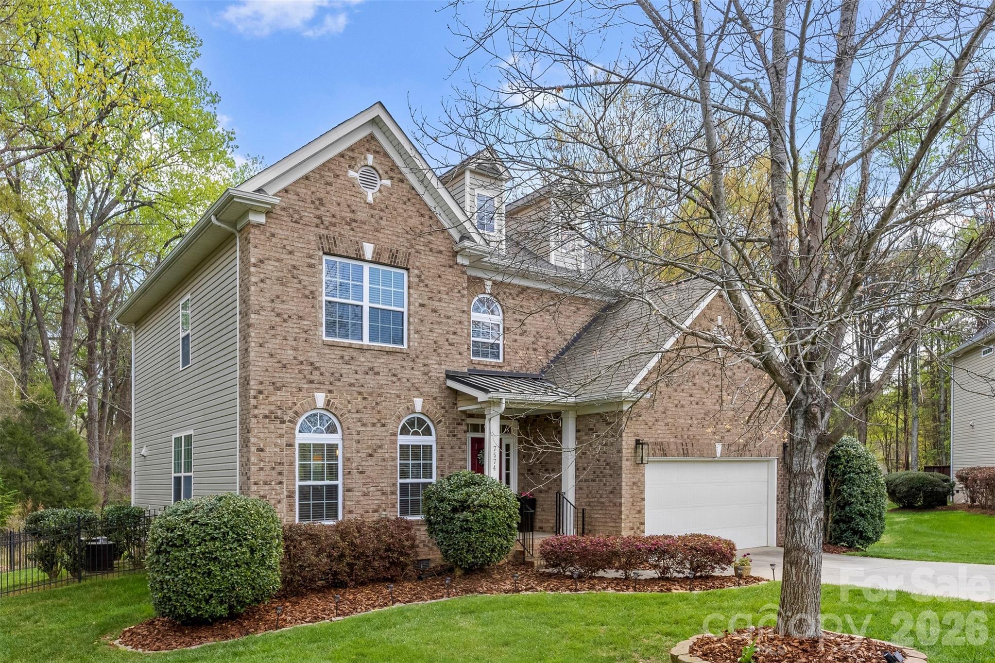 7574 Manakin Place Fort Mill, SC 29707 - Photo 3 of 40 front view of a house with a yard
