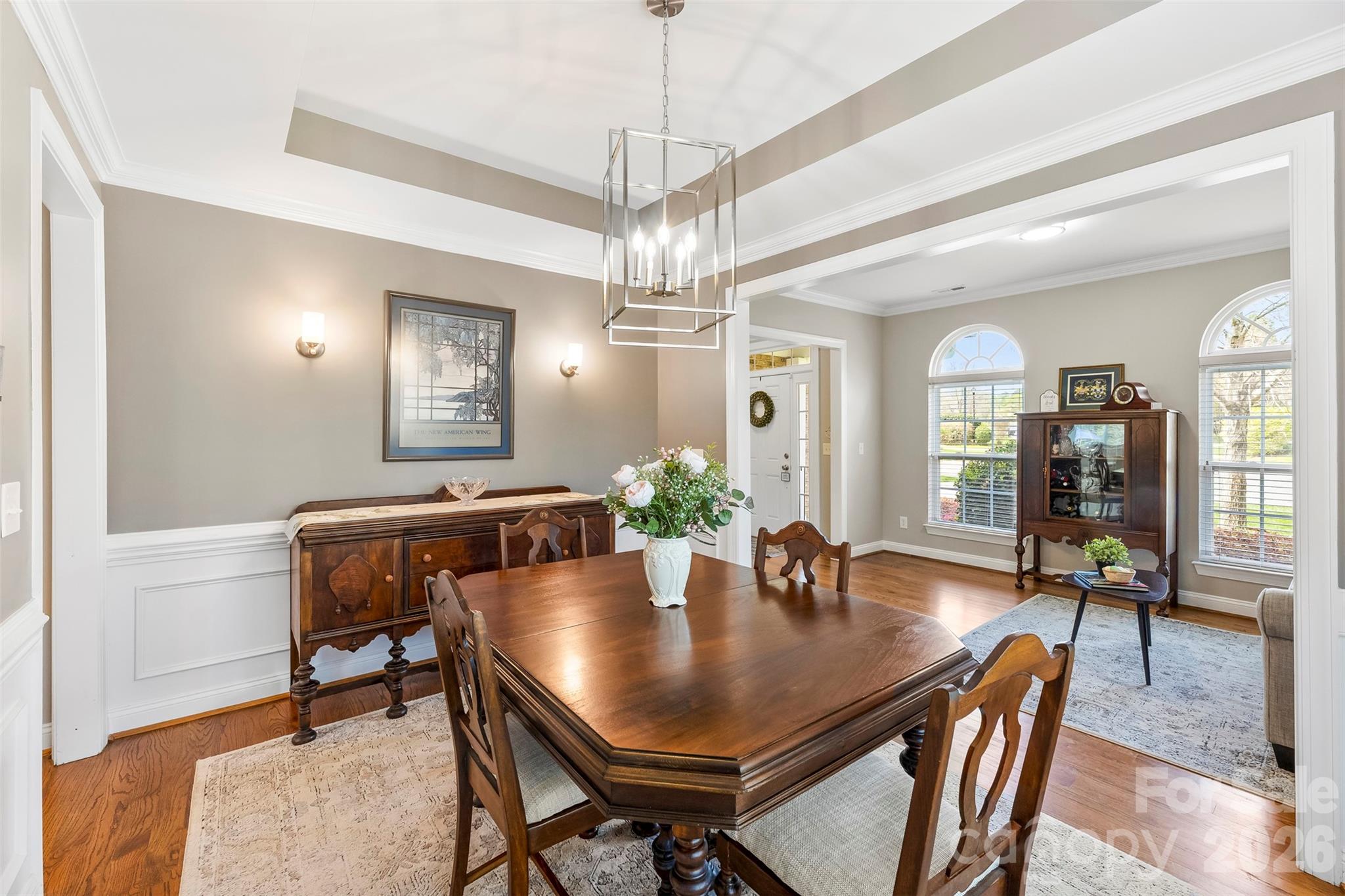 7574 Manakin Place Fort Mill, SC 29707 - Photo 7 of 40 a view of a dining room with furniture and wooden floor