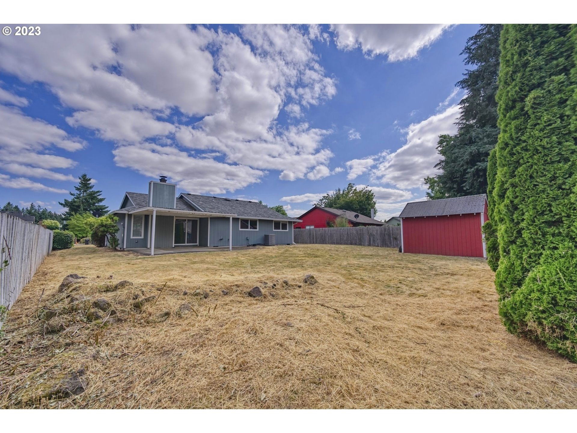 140 Southwest 8th Avenue Canby, OR 97013 - Photo 15 of 17 a front view of a house with a yard