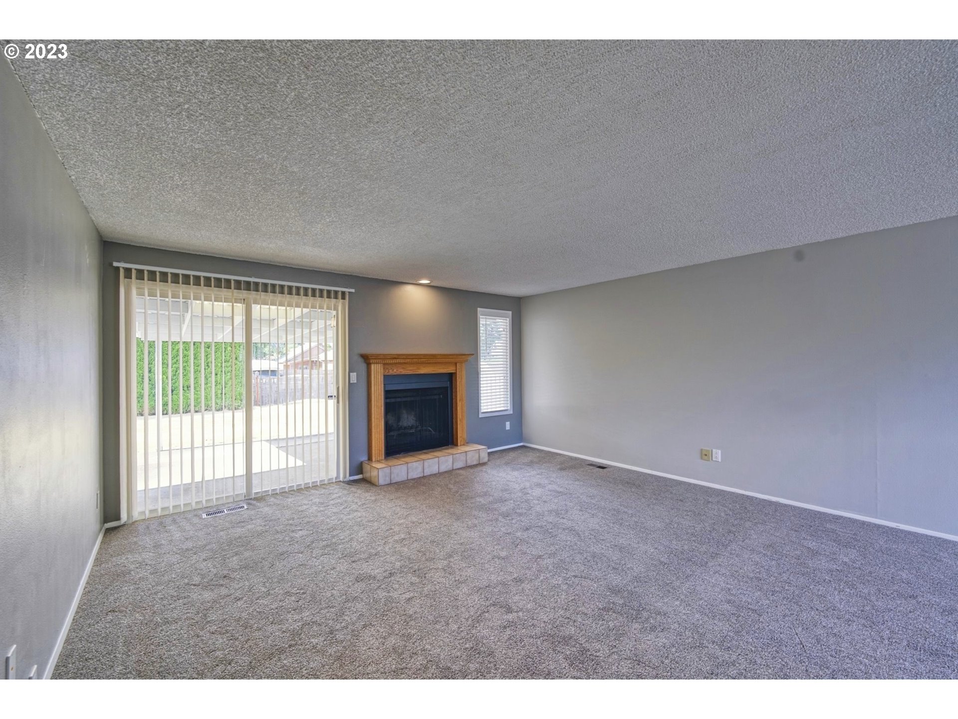 140 Southwest 8th Avenue Canby, OR 97013 - Photo 4 of 17 a view of empty room with floor to ceiling window