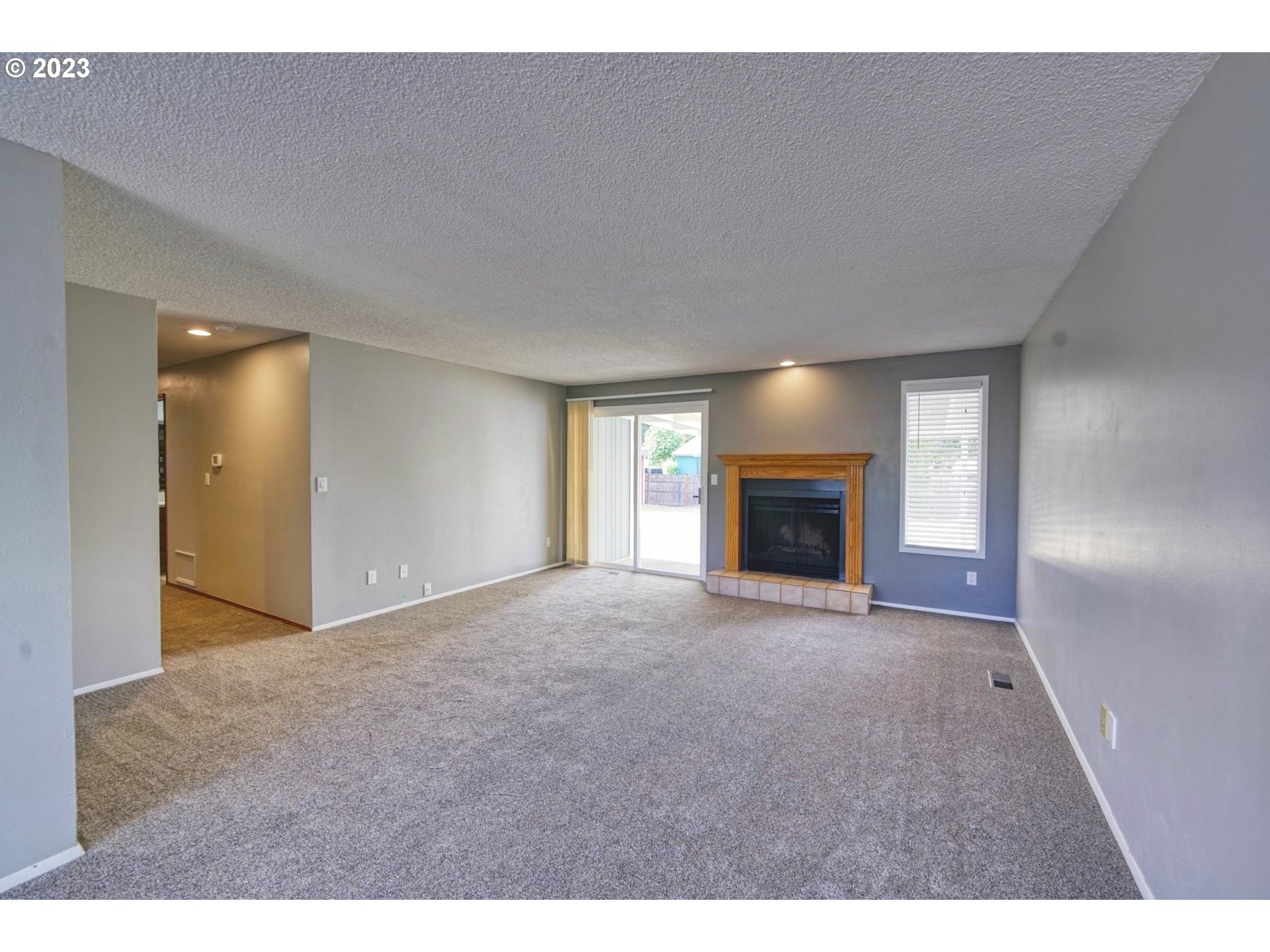140 Southwest 8th Avenue Canby, OR 97013 - Photo 6 of 17 a view of empty room with a fireplace