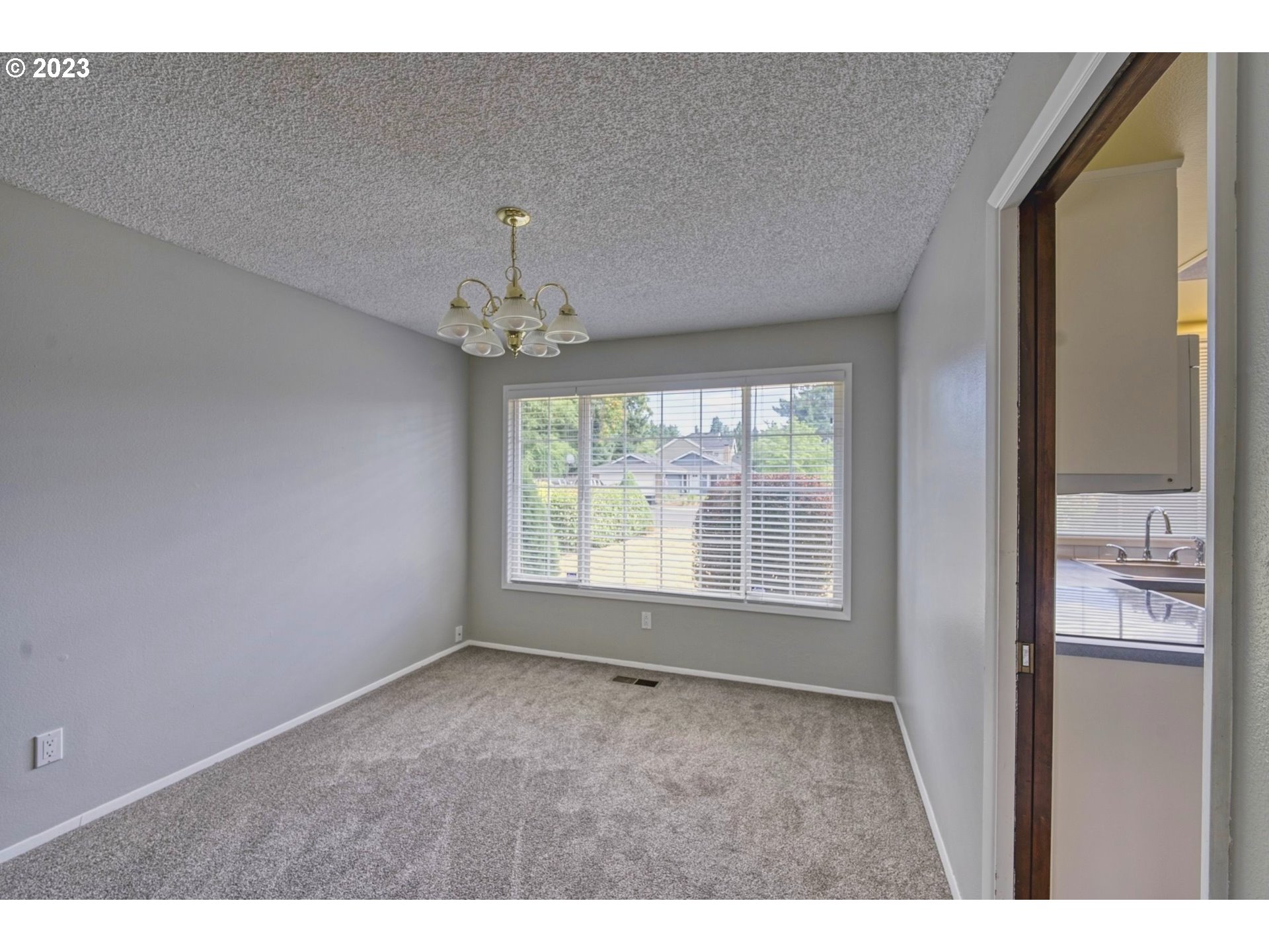140 Southwest 8th Avenue Canby, OR 97013 - Photo 7 of 17 a view of an empty room with a window