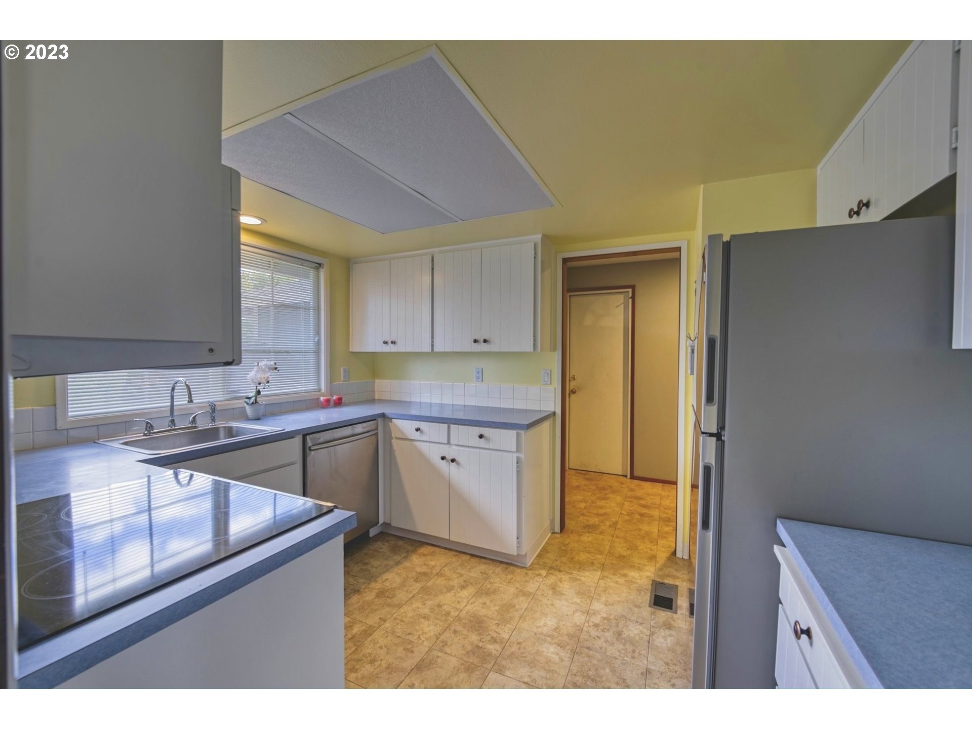 140 Southwest 8th Avenue Canby, OR 97013 - Photo 8 of 17 a kitchen with a sink stove and cabinets