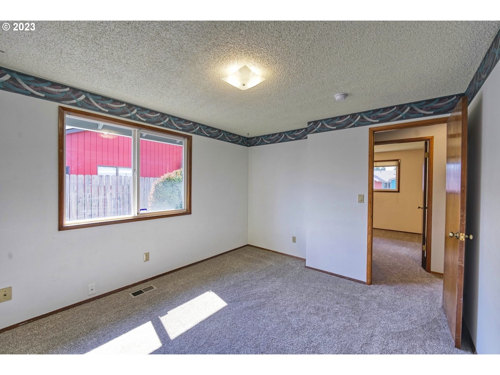 140 Southwest 8th Avenue Canby, OR 97013 - Photo 10 of 17 a view of empty room with window