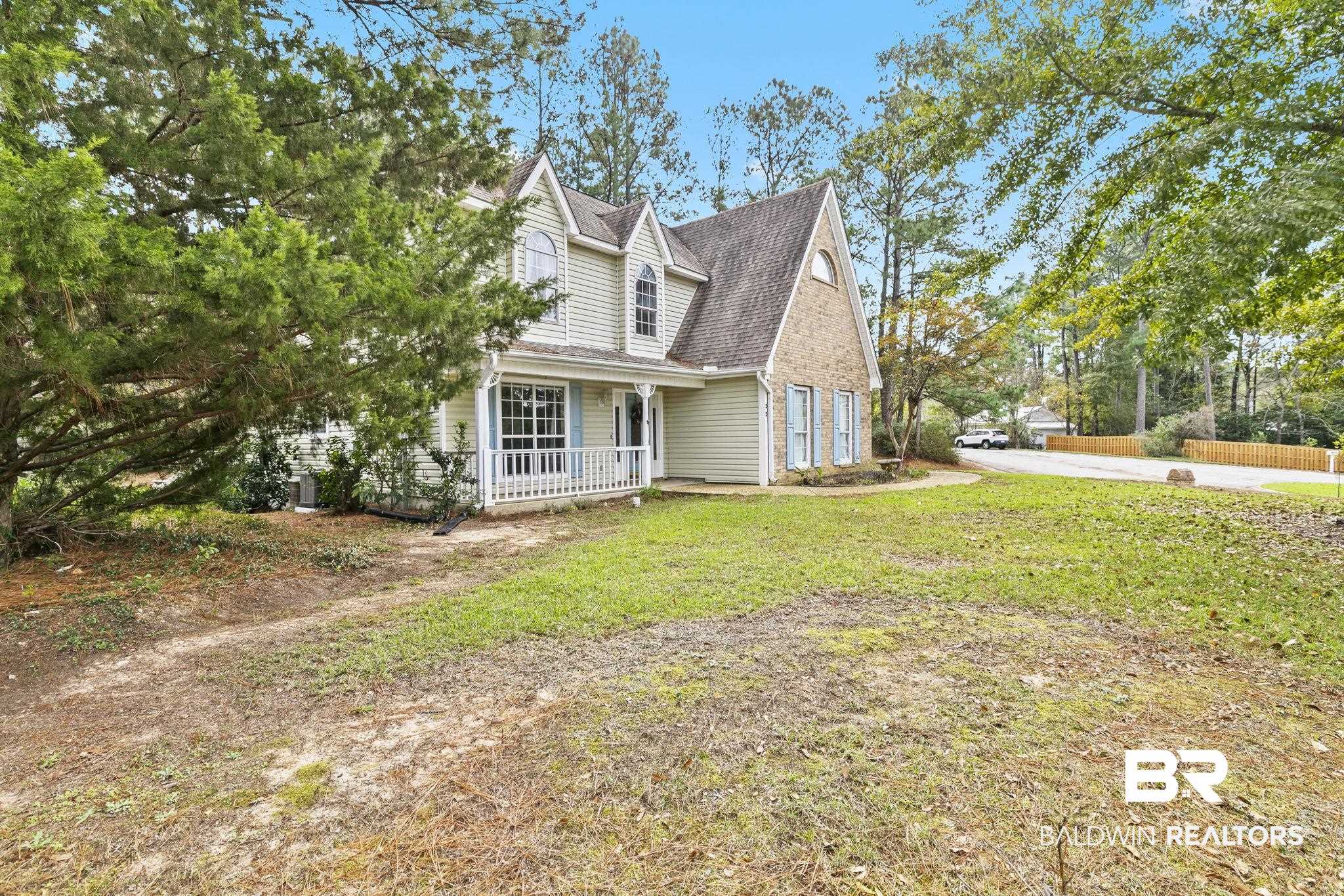 22 Pirates Lane Daphne, AL 36527 - Photo 34 of 36 View of side of home with a lawn and a porch