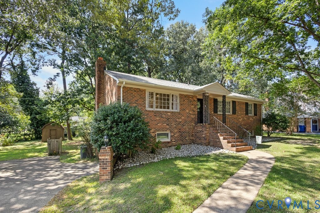 11440 Rochelle Road Chester, VA 23831 - Photo 2 of 31 a front view of a house with a yard