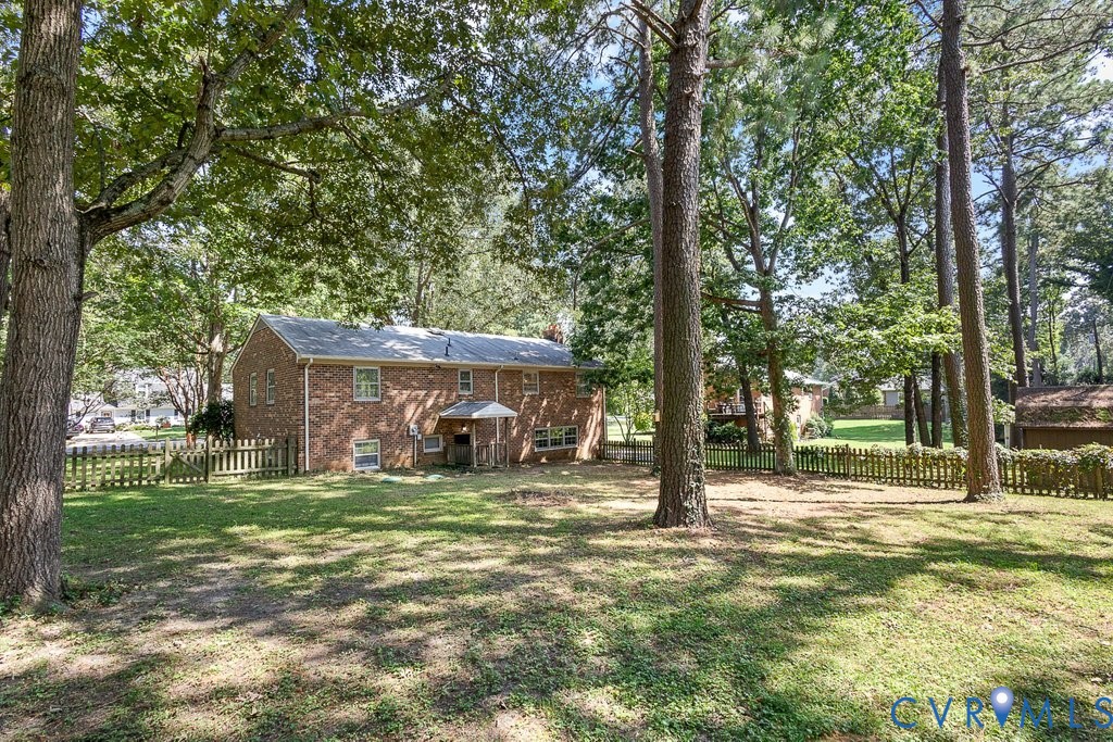 11440 Rochelle Road Chester, VA 23831 - Photo 29 of 31 a view of a house with a yard
