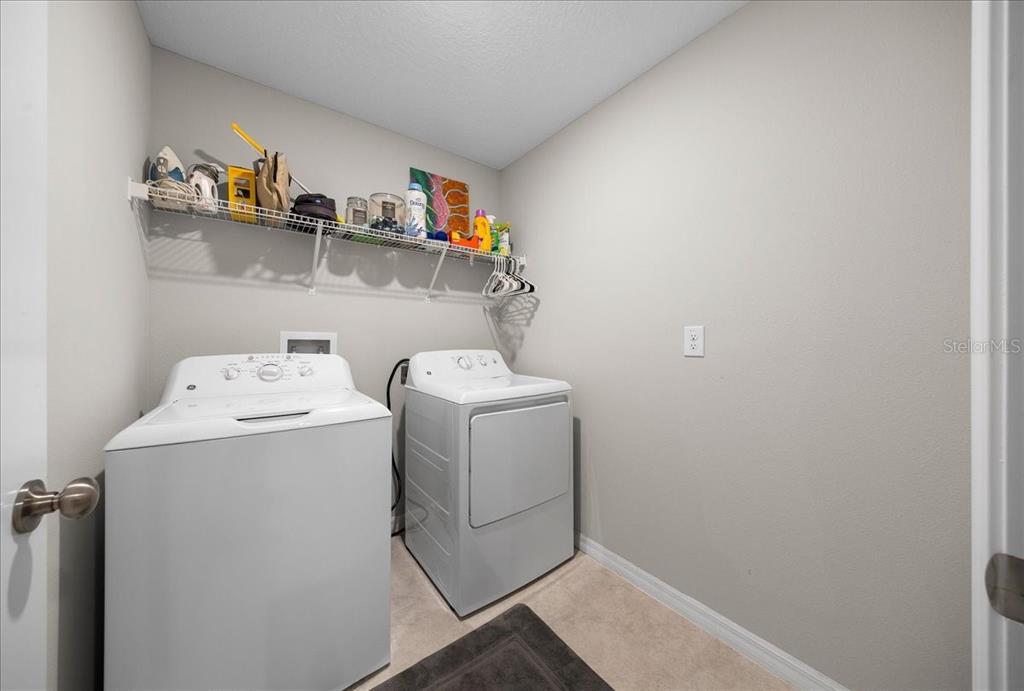 9329 Southwest 57th Terrace Ocala, FL 34476 - Photo 14 of 64 a utility room with dryer and washer