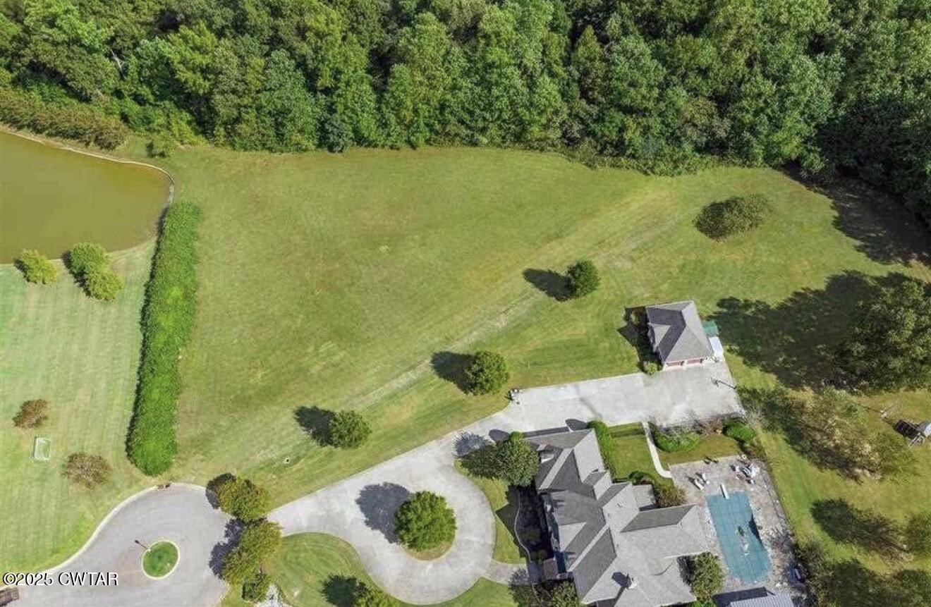 30 Bentbrook Cove Jackson, TN 38305 - Photo 3 of 8 a view of a balcony with floor to ceiling window and outdoor space