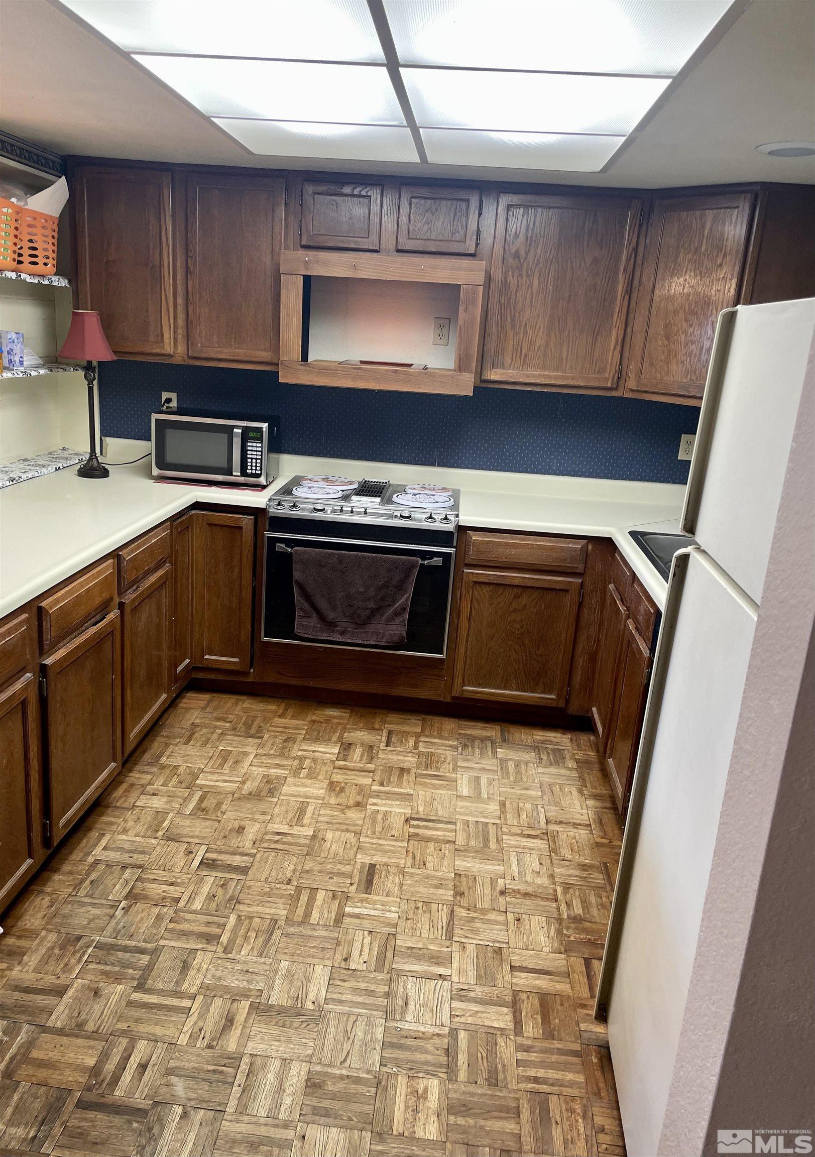 2606 Rayma Court Reno, NV 89503 - Photo 3 of 12 a kitchen with a stove and a sink