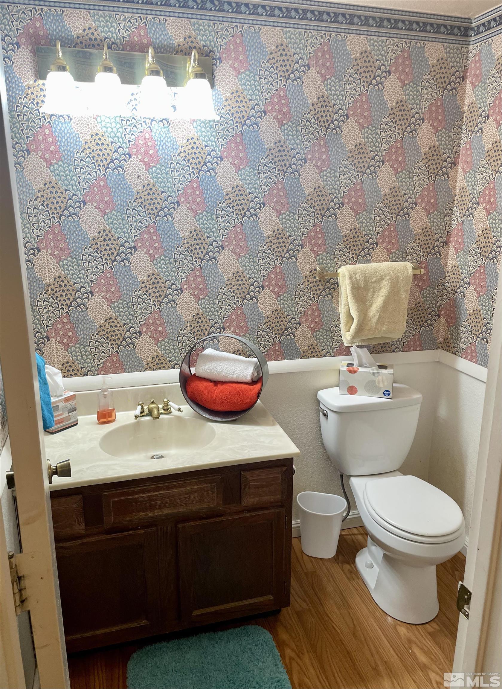2606 Rayma Court Reno, NV 89503 - Photo 5 of 12 a bathroom with a sink a toilet and a shower curtain