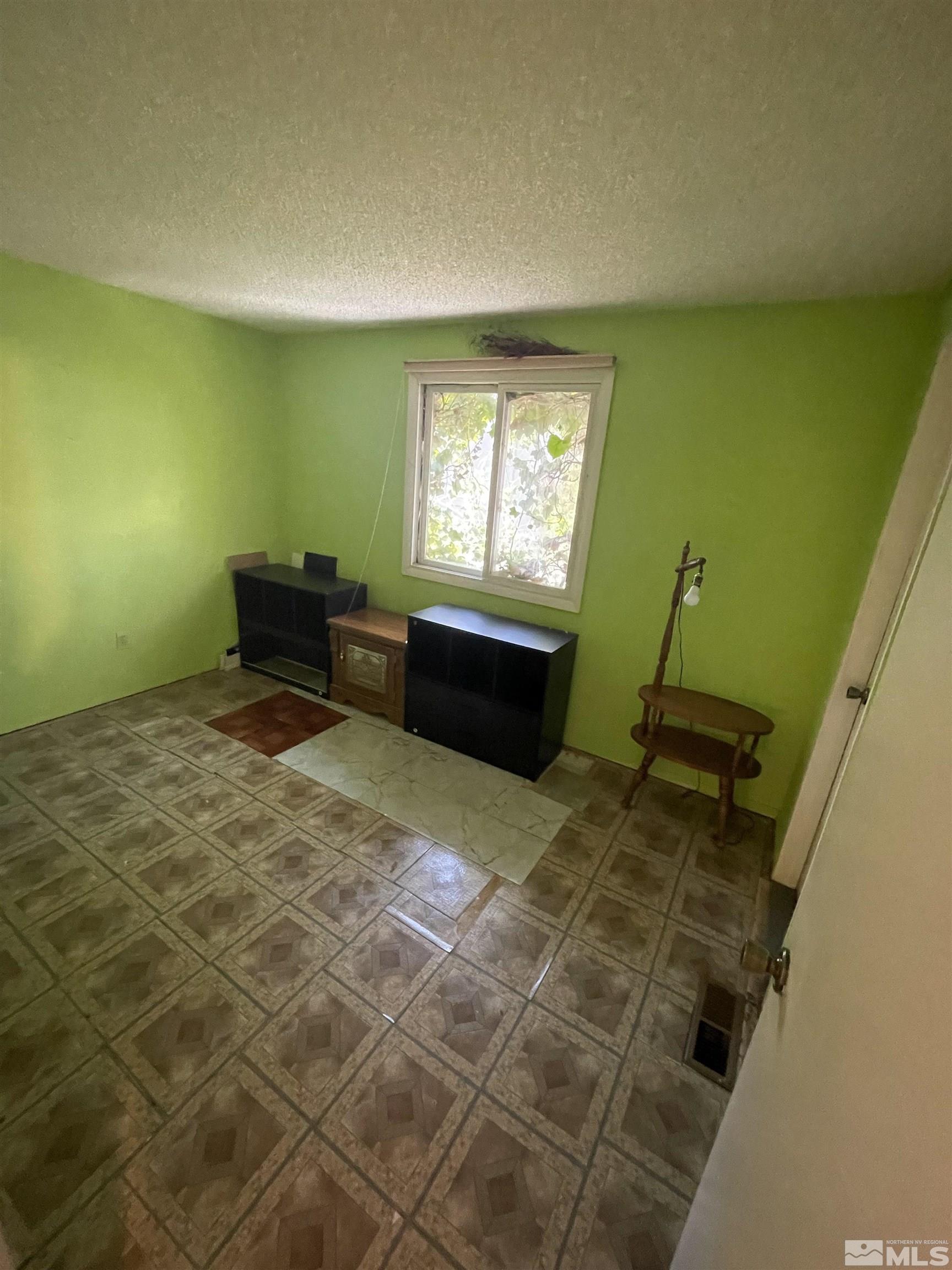 2606 Rayma Court Reno, NV 89503 - Photo 6 of 12 a room with furniture and a window