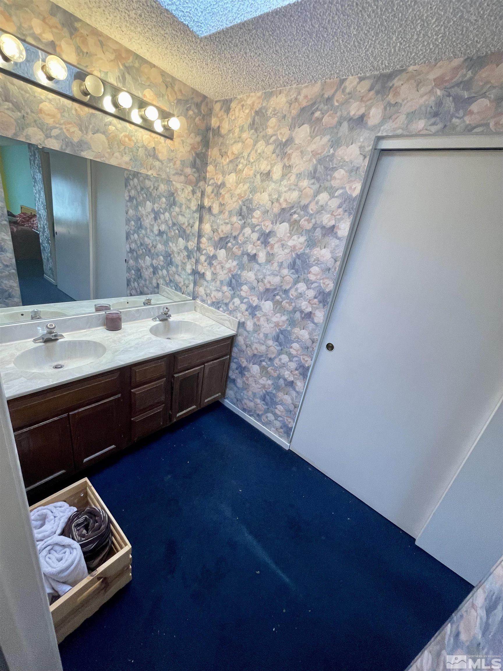 2606 Rayma Court Reno, NV 89503 - Photo 10 of 12 a room with a bed and a table