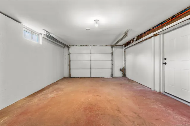 an empty room with a empty space and windows