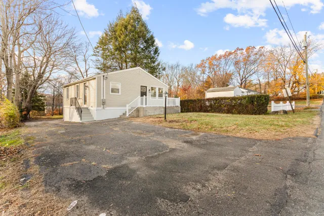 a view of yard with large trees