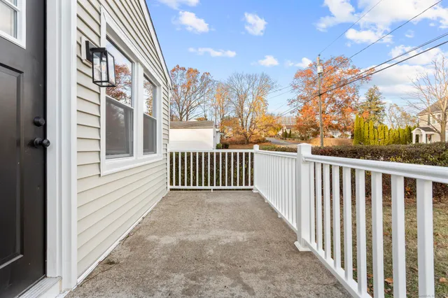 a view of a balcony with a pot