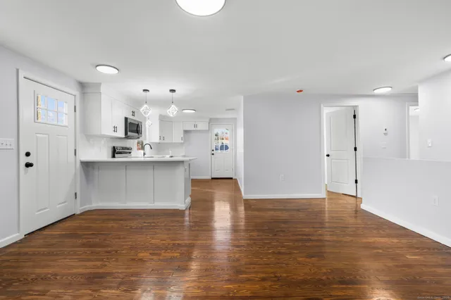 a view of kitchen with wooden floor