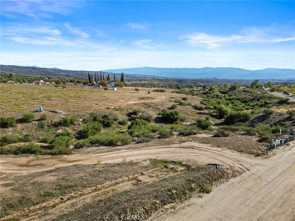 33945 Red Mountain Road Hemet, CA 92544 - Photo 7 of 30 a view of a lake with a yard