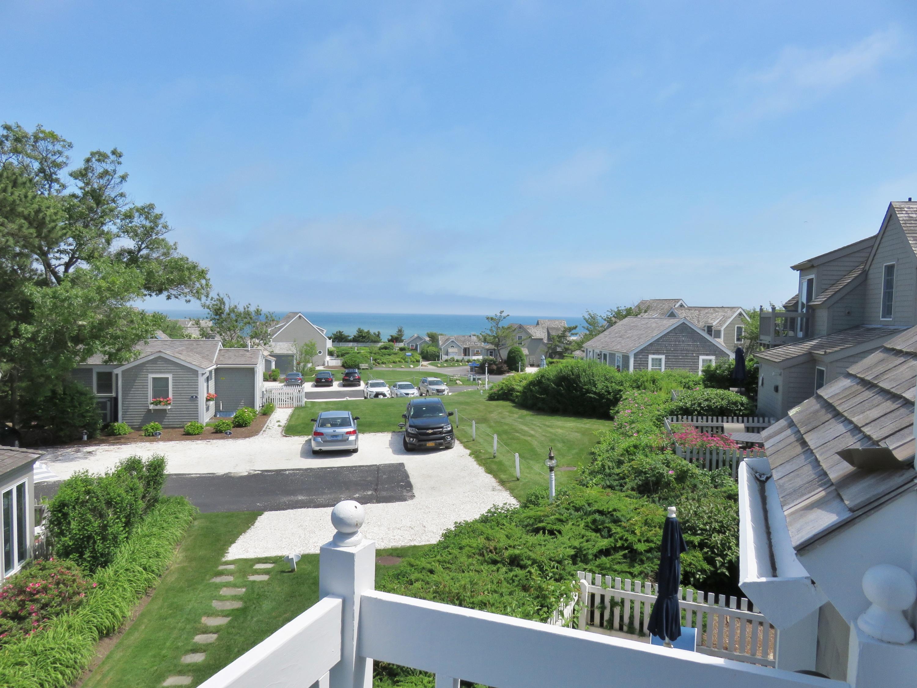 23 Brant Rock Road Mashpee, MA 02649 - Photo 1 of 34 an aerial view of a house with a yard and table