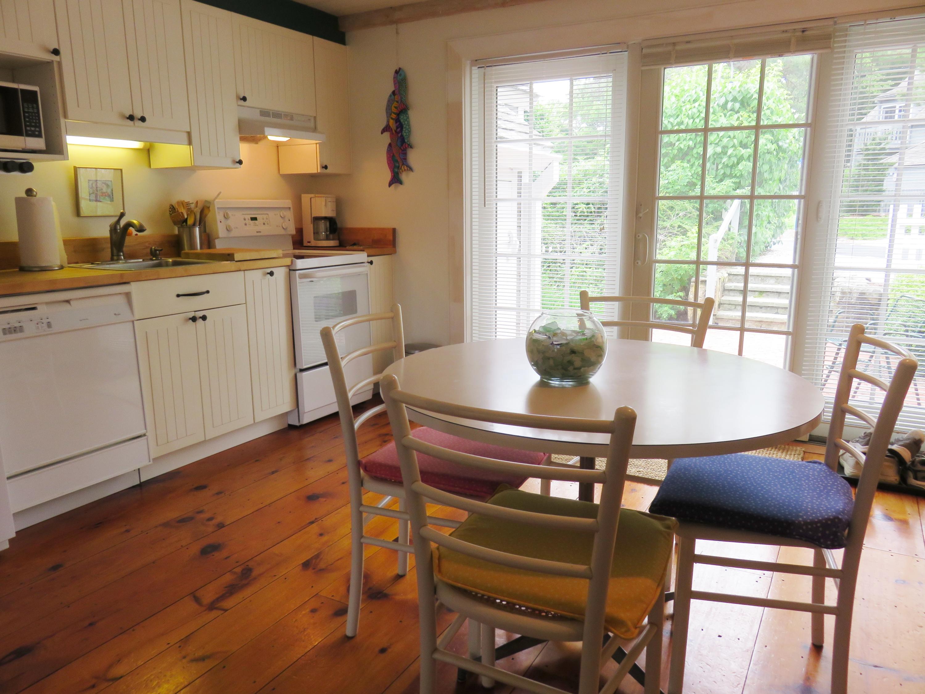 23 Brant Rock Road Mashpee, MA 02649 - Photo 12 of 34 a view of a dining room with furniture and wooden floor