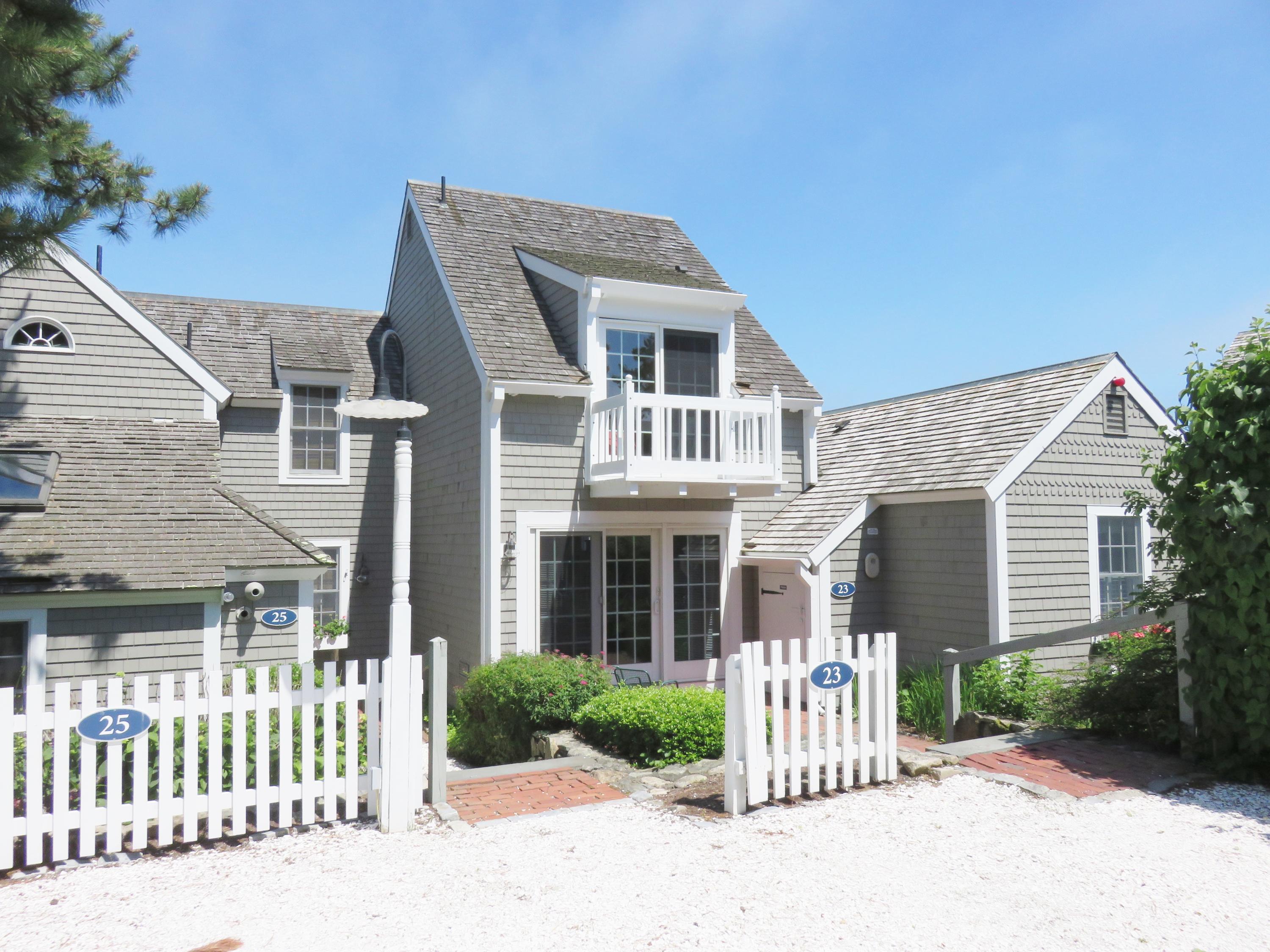 23 Brant Rock Road Mashpee, MA 02649 - Photo 3 of 34 front view of a house with a yard