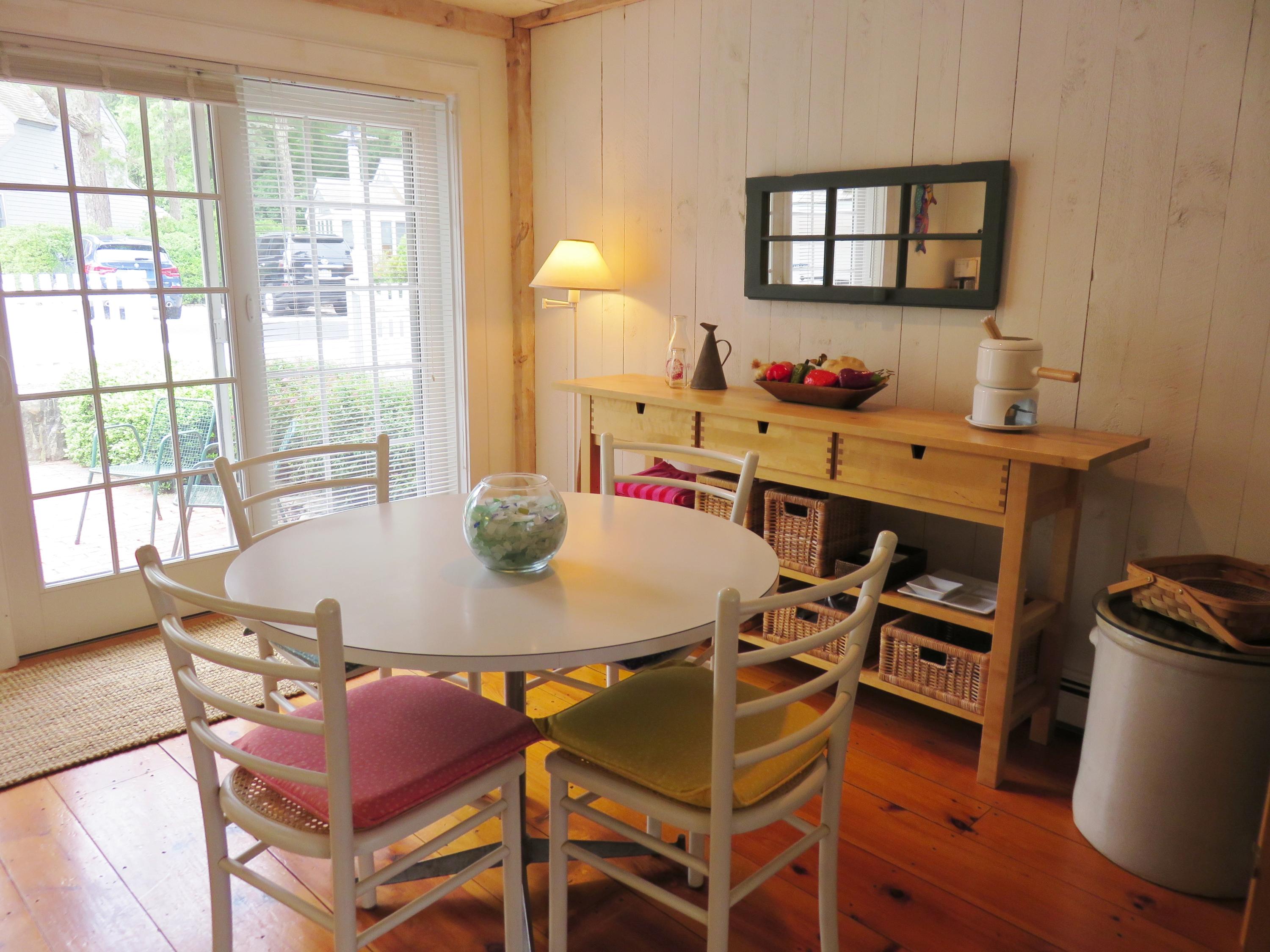 23 Brant Rock Road Mashpee, MA 02649 - Photo 8 of 34 a dining room with furniture and wooden floor