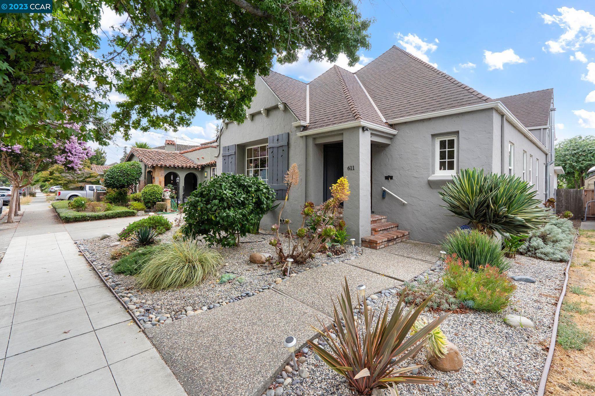 a front view of a house with garden