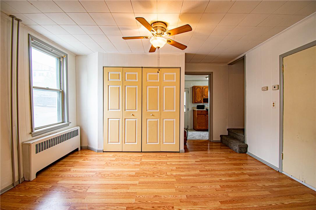 27 West Allen Street Allentown, PA 18102 - Photo 8 of 26 Golden wood floors and a ceiling fan create a comfortable atmosphere.