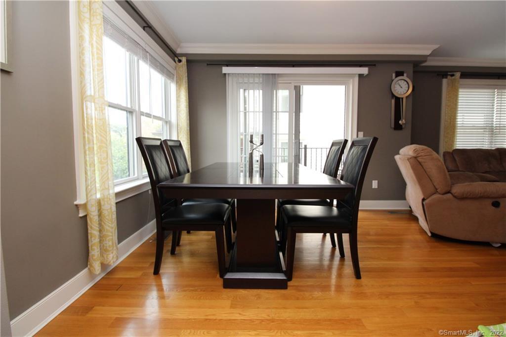 109 Forest Street, Unit 5 Stamford, CT 06901 - Photo 8 of 21 a view of a dining room with furniture window and wooden floor