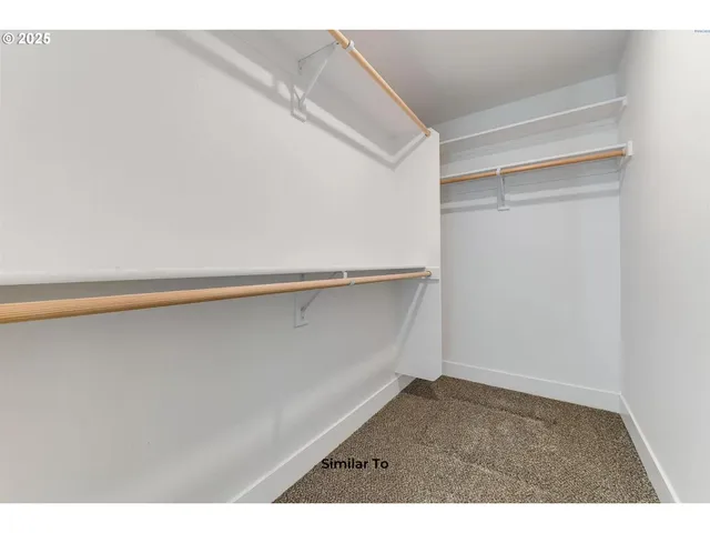 a view of an empty walk in closet