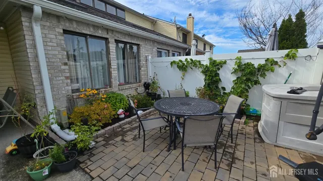 a view of a chairs and table in a patio