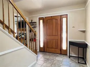 a view of an entryway with stairs