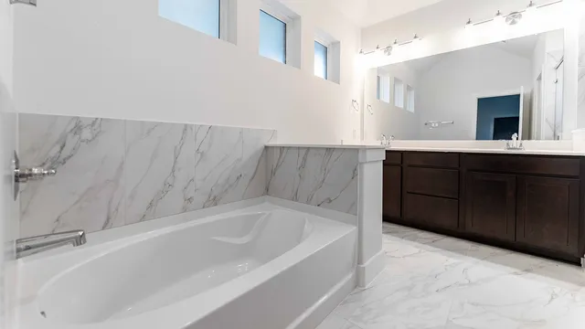 a bathroom with a bathtub and a sink