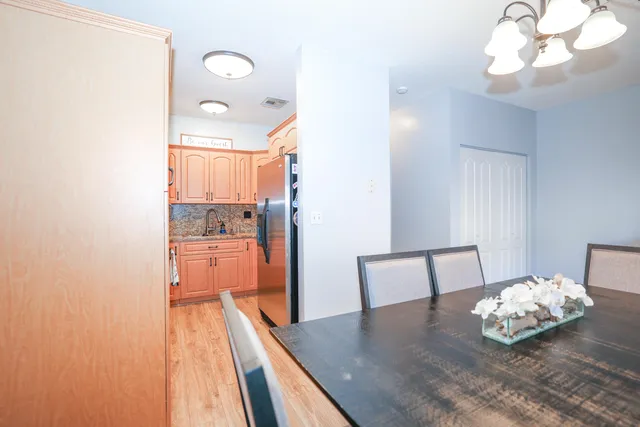 a view of kitchen with furniture and wooden floor