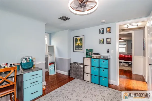 a bedroom with a bed and a couch