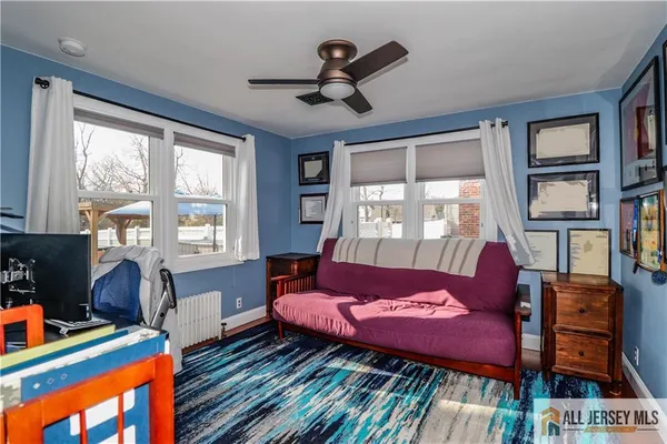 a bed room with a bed and a book shelf