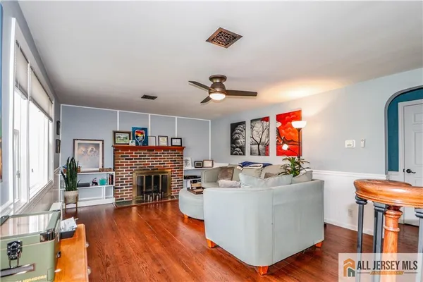 a living room with furniture and a fireplace