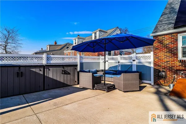 a view of a house with a backyard and a tub