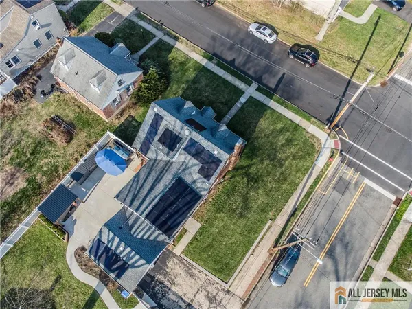 an aerial view of residential building with parking