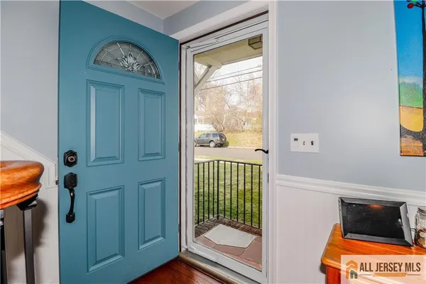 a view of front door with a door and a window