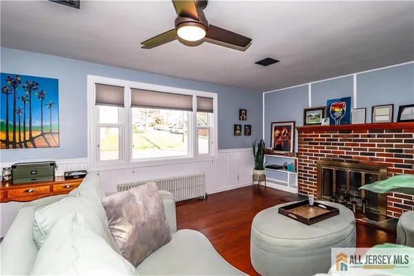 a living room with furniture and a fireplace