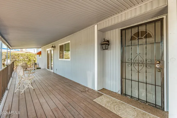 a view of a chairs and table in the patio