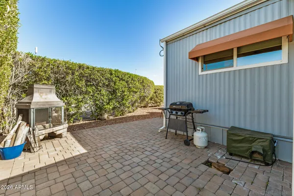 a large kitchen with a large window and stainless steel appliances