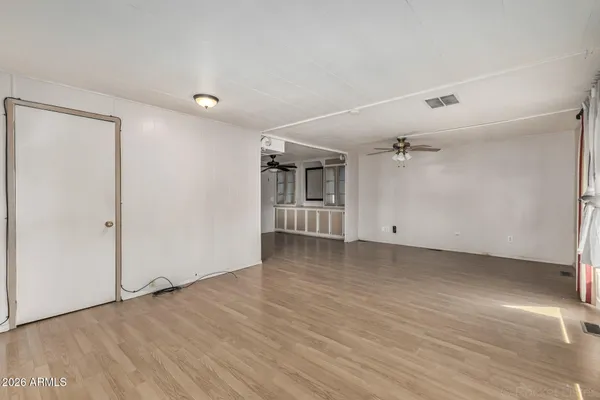 a large kitchen with stainless steel appliances lots of counter space and a sink