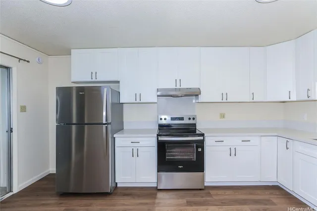 a kitchen with a white cabinets and white appliances